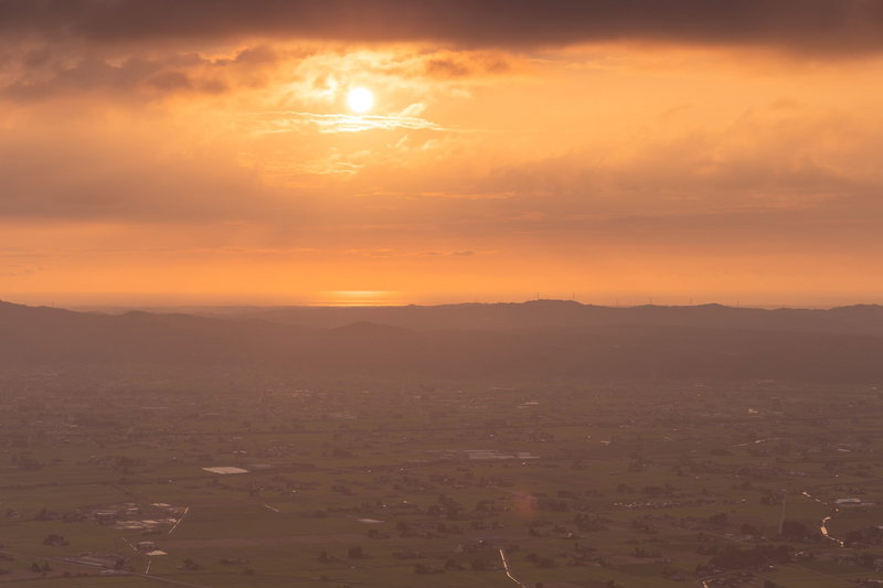 夕焼けと散居村の写真素材