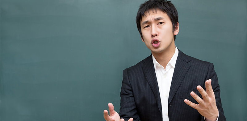 「今でしょ！」熱血指導に力が入る塾講師の写真素材