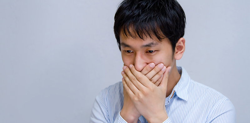 もしかして年収低すぎ！？驚く男性の写真素材