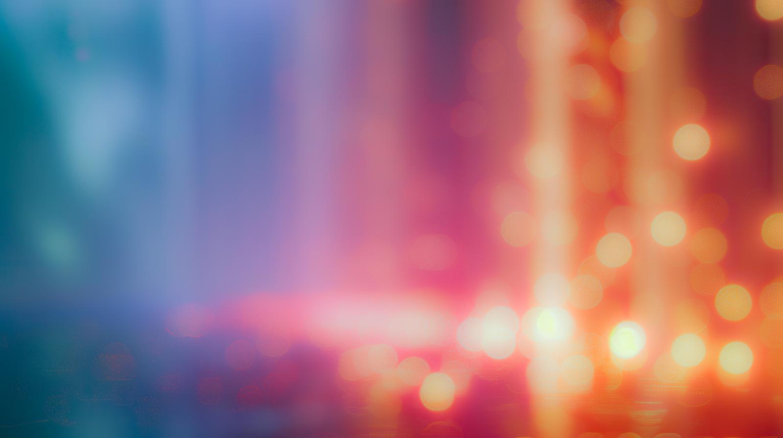 青と赤の光が混ざり合うぼやけたグラデーション背景