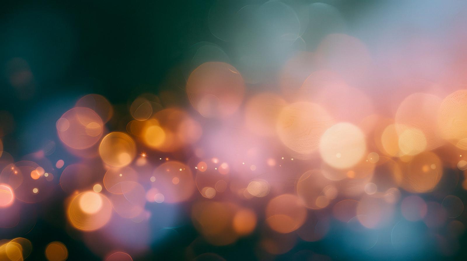 ぼやけた光の粒が輝く暖色系の幻想的な背景