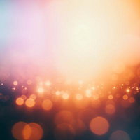 オレンジとターコイズのグラデーションボケ効果の写真