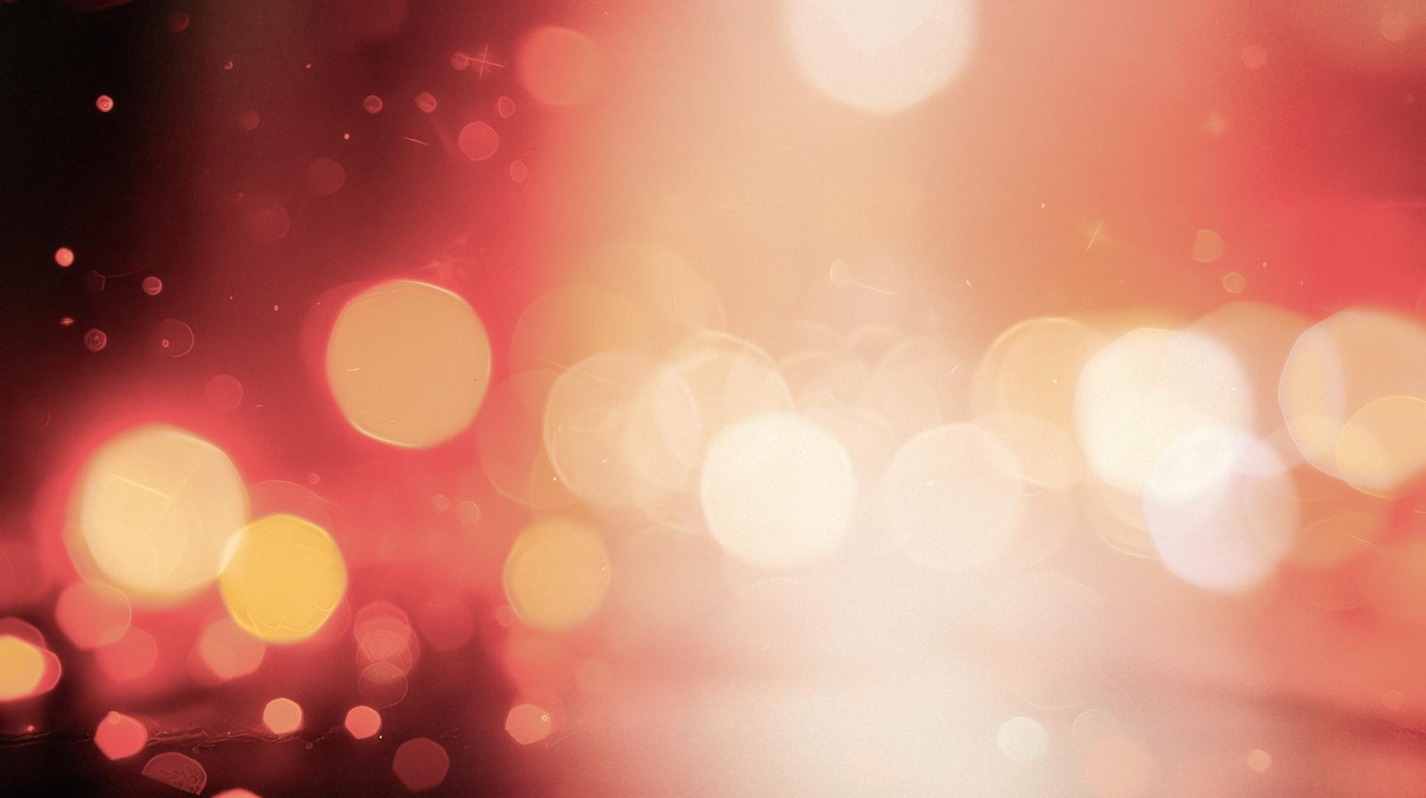 Overlapping red and orange blurred circles on an abstract background
