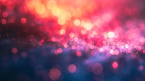 赤とピンクに輝く光が交じり合うボケ背景