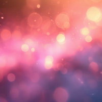 温かみのあるピンク色に輝く光のきらめきと玉ボケの写真