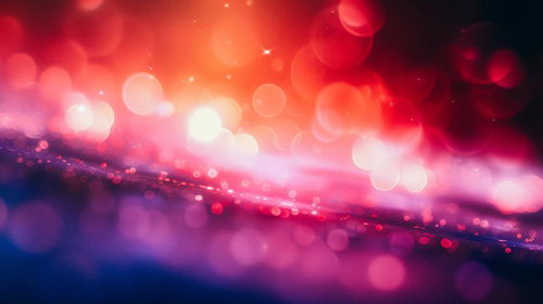 赤、ピンク、オレンジに輝く光の玉が流れる光景