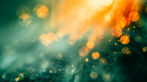 オレンジとグリーンの輝きが浮かぶぼんやりとした光の背景