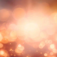 柔らかなオレンジ色の光が玉ボケで広がる幻想的な光景の写真