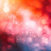 オレンジと赤の光の粒が揺らぐきらめきの風景の写真