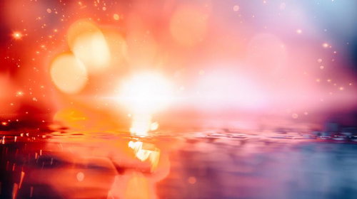 水面に浮かぶ輝く光の粒がきらめく幻想的な光景