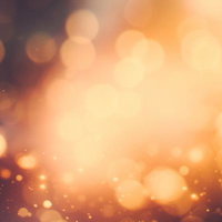 暗闇から溢れ出る光の粒と玉ボケ、きらめく煌めきの背景の写真