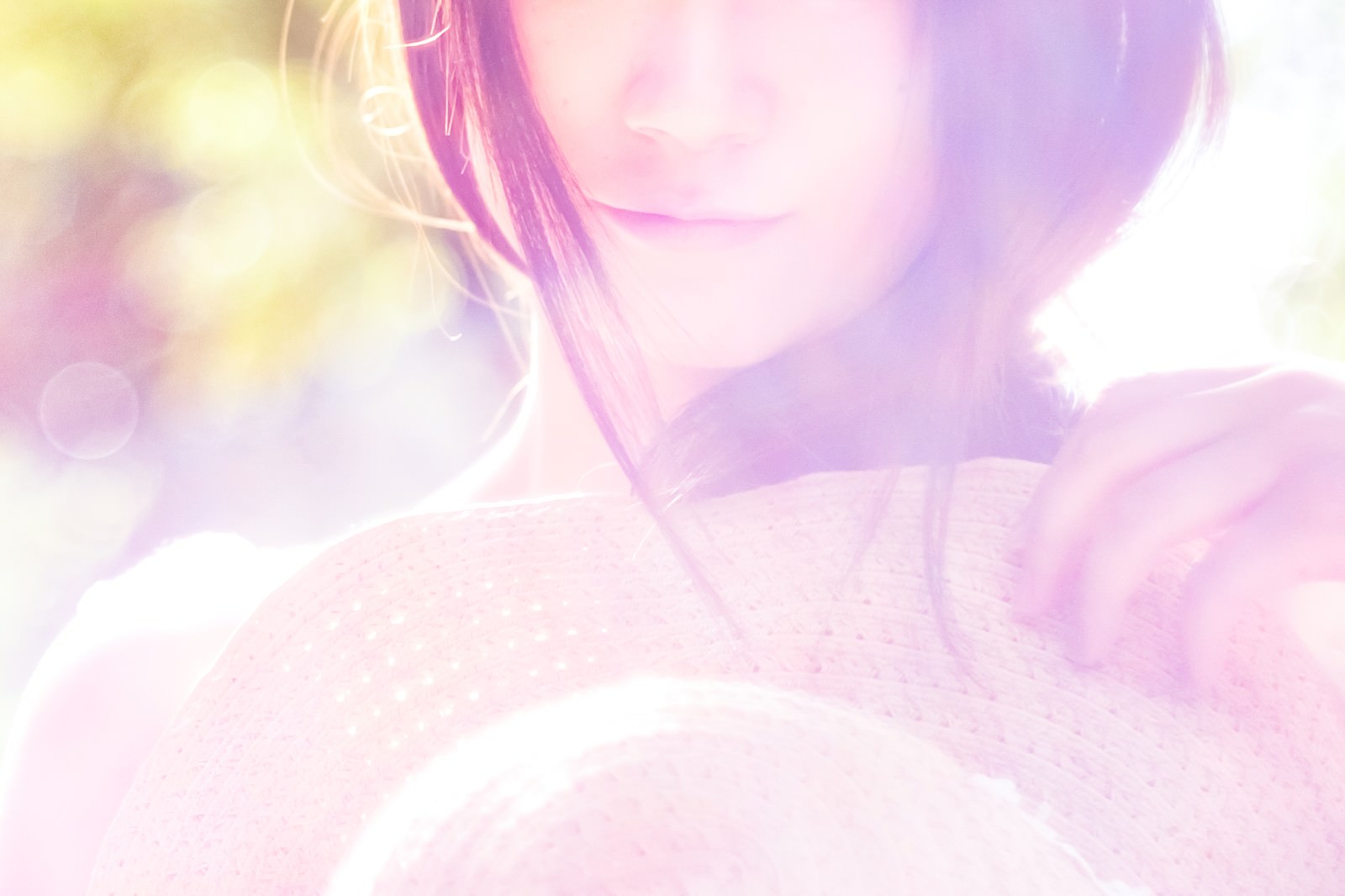 Woman's lips enveloped in pastel colors