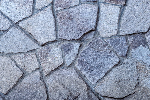 グレー系の不揃いなタイルが敷き詰められた地面テクスチャー