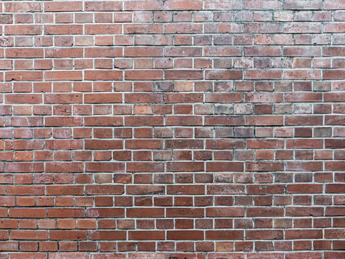 劣化が目立つ煉瓦の外壁テクスチャ