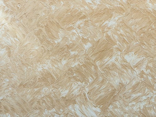 規則性のあるベージュ系まだら模様の壁紙テクスチャー