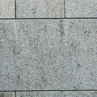 グレー系の石材タイルを張り合わせた床のテクスチャの写真