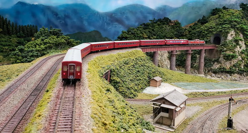 勾配区間に挑むDD51形ディーゼル機関車牽引の50系客車列車のジオラマ