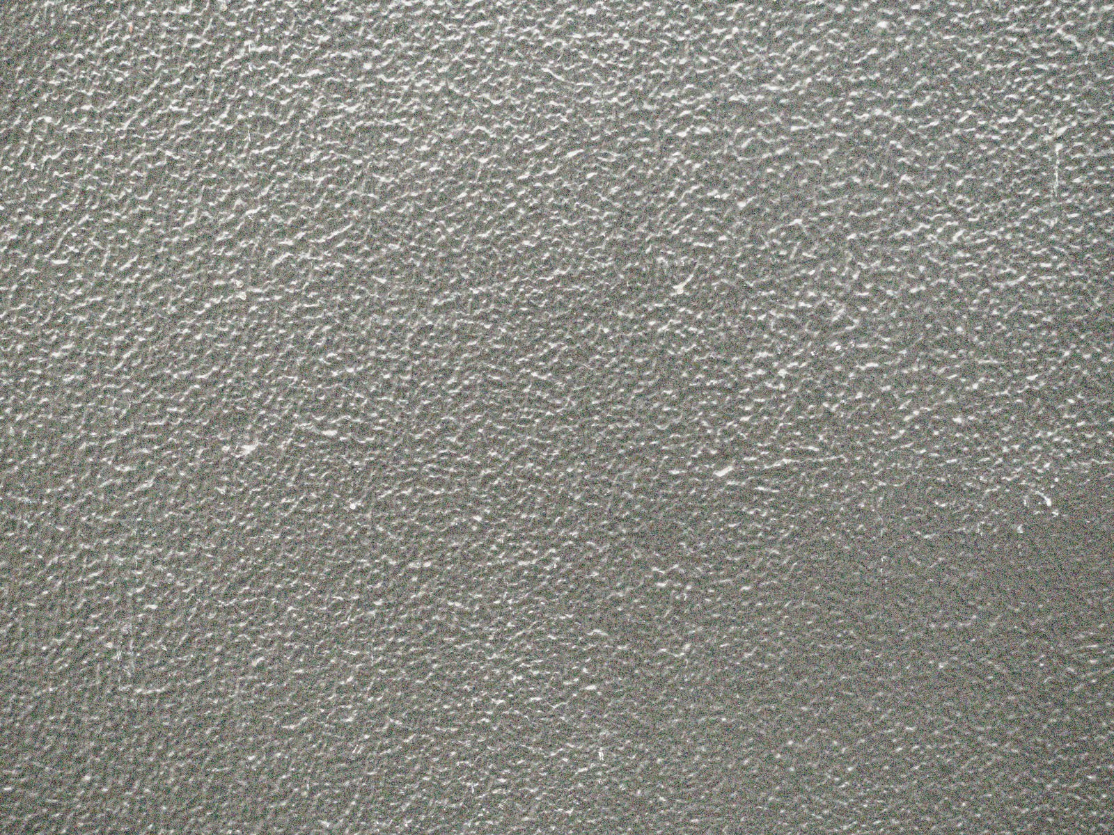 ざらついた質感のグレーのコンクリート壁面