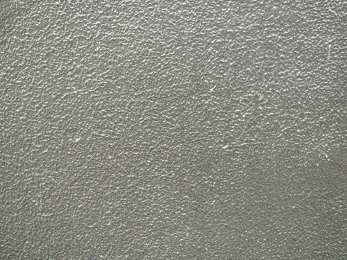 ざらついたグレーのコンクリート壁のテクスチャー