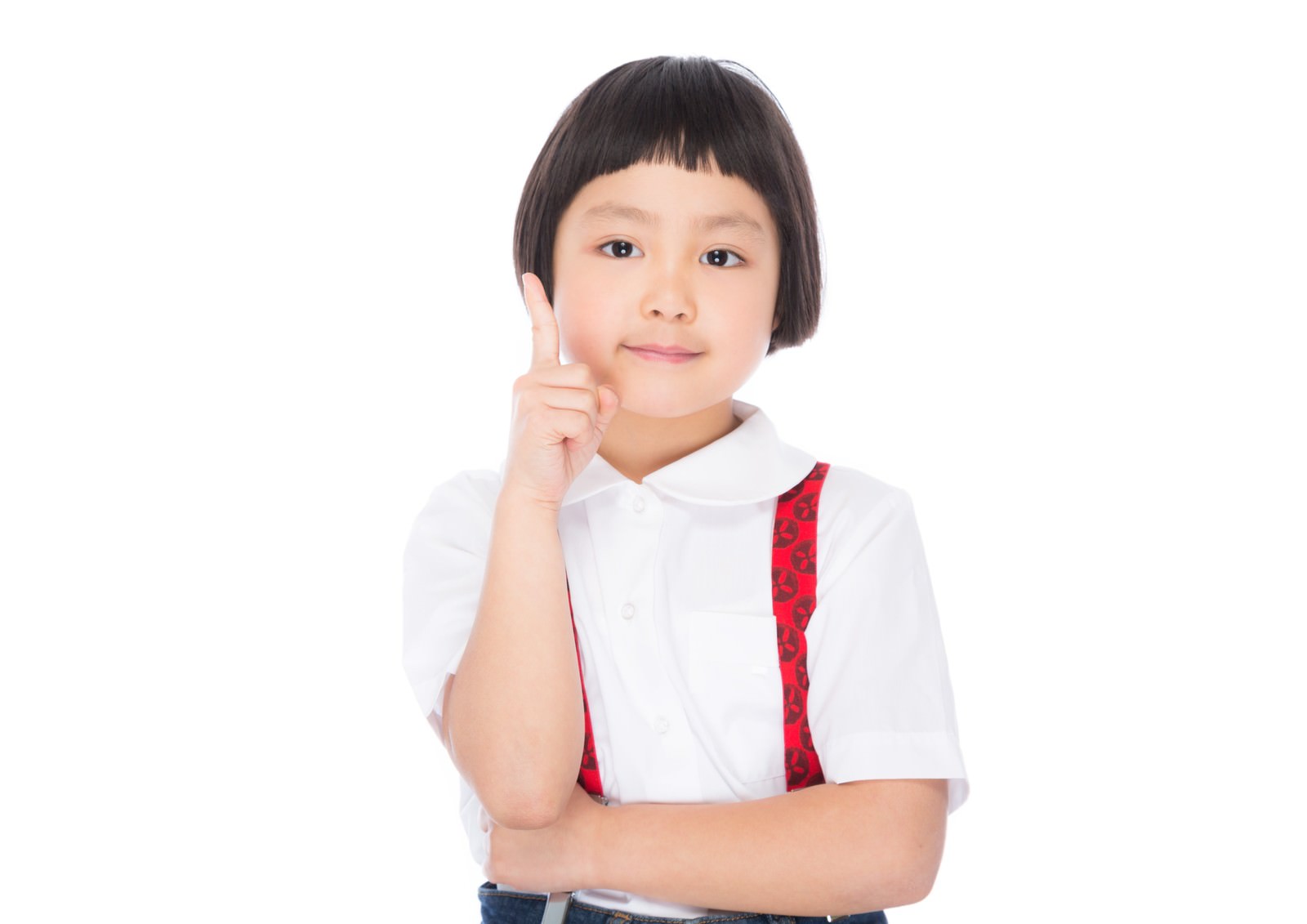 学校制服を着たおかっぱ頭の女の子が、指をさすポーズでアドバイスをする笑顔の正面ショット［モデル：ゆうき］