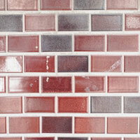 光沢のあるレンガ風のテカるタイル壁のテクスチャーの写真