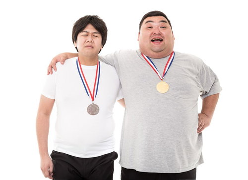 LからXLへ。それはワンランク上の男になった証。メダルを掲げる二人
