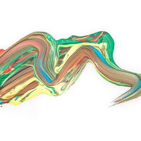 緑とオレンジと黄色が混ざり合った塗料の流動的グラデーションの写真