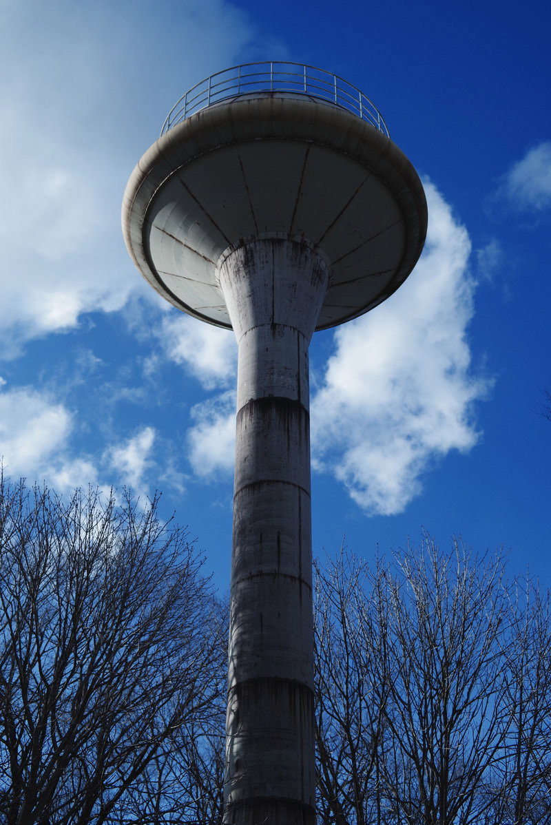 Circular water tower at Nasu Service Area with blue sky and clouds