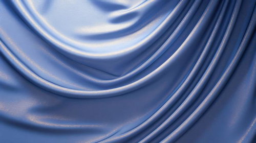 光沢を放つ波打つ青いサテン生地のドレープテクスチャー