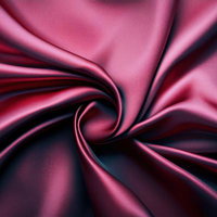 渦巻くように広がる光沢生地の写真