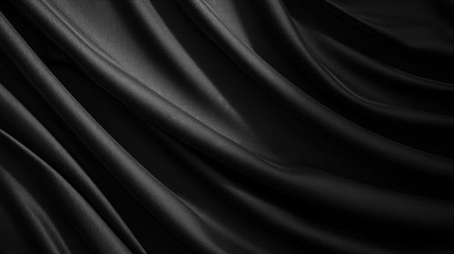 黒い布の波打つような動きと光沢を捉えたサテン生地