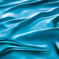 青い布のしわが波打つサテン生地のクローズアップテクスチャーの写真