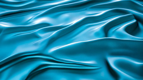 青い布のしわが波打つサテン生地のクローズアップテクスチャー