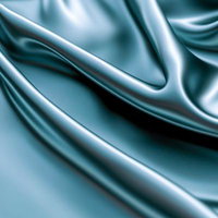 光沢を放つターコイズブルーのサテン生地のドレープの写真