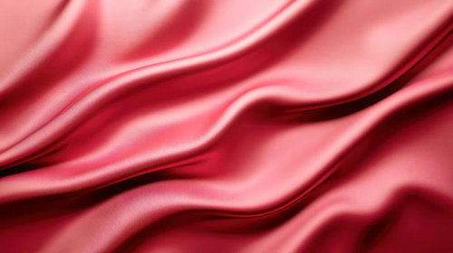 鮮やかなローズピンクのサテン生地の流れるようなドレープ