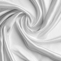 柔らかな光沢と繊細なドレープの白い布地の写真