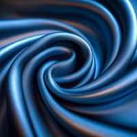 滑らかな曲線美を描く青いサテンの質感と渦巻きの写真