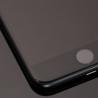 黒いスマートフォンの感圧タッチホームボタンの写真