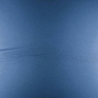 傷がついた青い表面のテクスチャーの写真