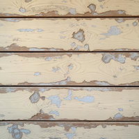 塗装が剥がれた木の板壁のテクスチャーの写真