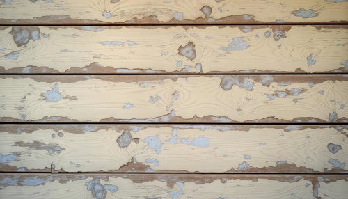 塗装が剥がれた木の板壁のテクスチャー