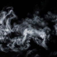 煙・スモーク、黒背景の渦巻きの写真