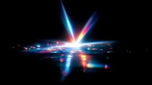 漆黒の背景に輝く青とピンクのレンズフレア