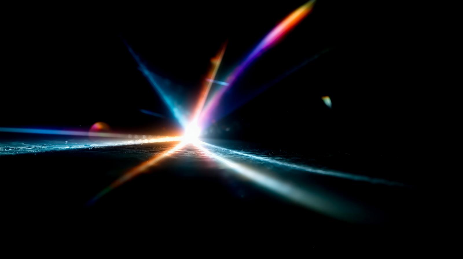 Bright central point radiating rainbow-colored light rays