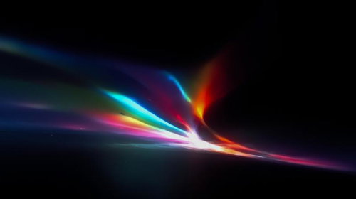 暗闇から放射状に広がるカラフルな光の束
