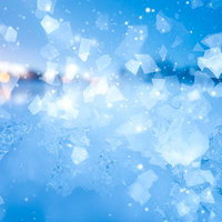 青い氷の結晶と光の粒子が舞う冬のデジタル背景の写真