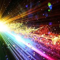 虹色に放射する光線とエネルギー粒子の写真