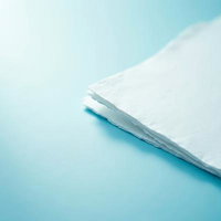 水色の背景に置かれた白い和紙のAI画像