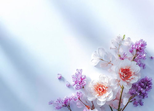 淡い紫とオレンジの花びらが映えるフラワーアレンジメント