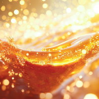 宝石のように煌めく黄金色の水滴の写真